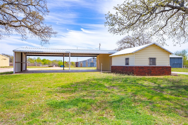 exterior space with a yard and a carport