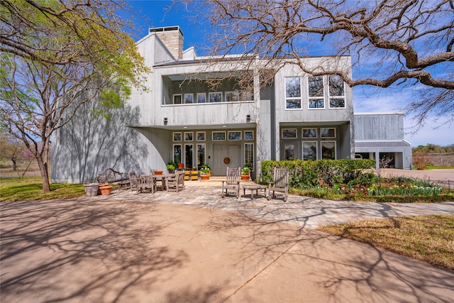 rear view of property featuring a patio