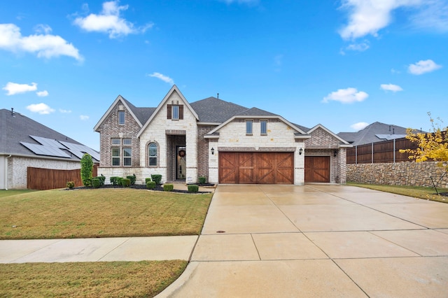 view of front facade featuring a front lawn and a garage