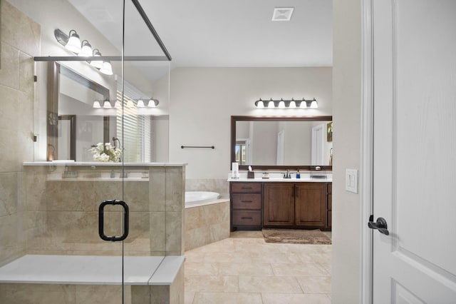 bathroom featuring separate shower and tub, tile patterned flooring, and vanity