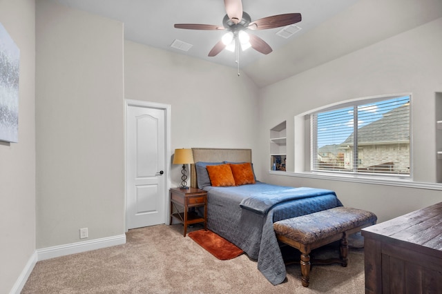 bedroom with light colored carpet, vaulted ceiling, and ceiling fan