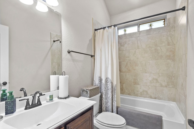 full bathroom featuring vanity, shower / bath combination with curtain, and toilet