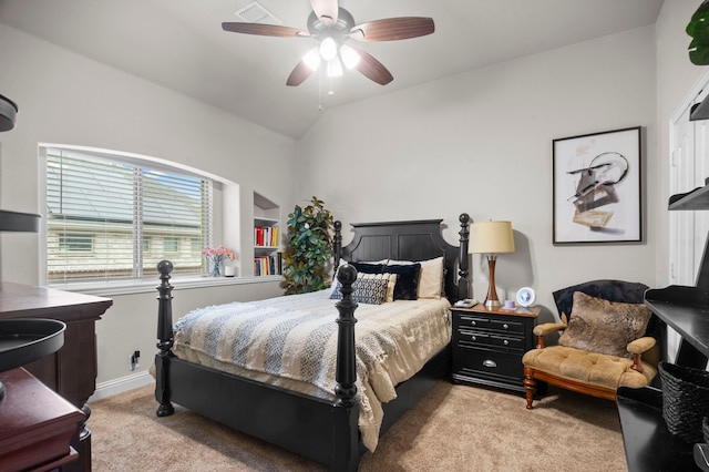 bedroom featuring ceiling fan, light colored carpet, and lofted ceiling