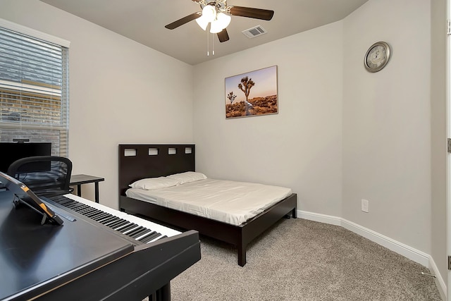 bedroom featuring a ceiling fan, carpet flooring, visible vents, and baseboards