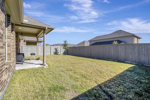 view of yard featuring a patio area and a fenced backyard