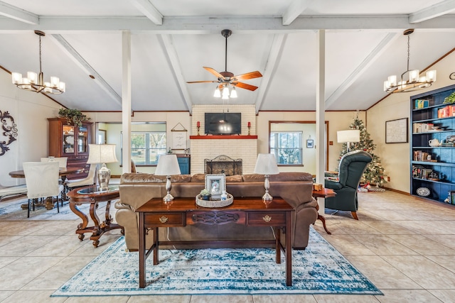 tiled living room with vaulted ceiling with beams, a fireplace, and ceiling fan with notable chandelier