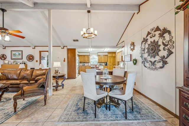 dining space with lofted ceiling with beams, light tile patterned floors, and ceiling fan with notable chandelier