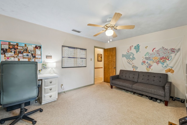 home office featuring ceiling fan and light colored carpet