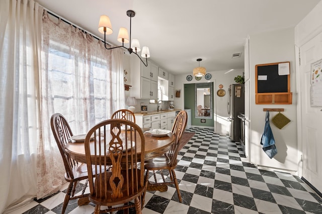 dining area with dark floors and visible vents