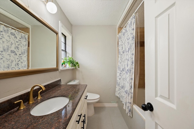 full bath featuring toilet, a textured ceiling, vanity, baseboards, and tile patterned floors