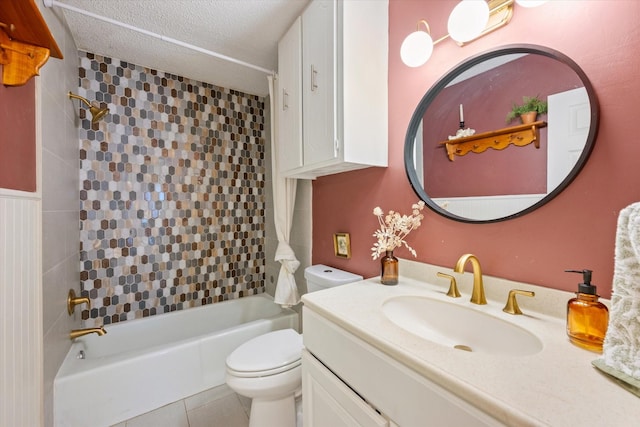 full bath featuring a textured ceiling, shower / bathtub combination, tile patterned flooring, toilet, and vanity