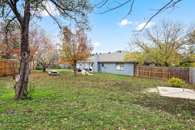 view of yard with a fenced backyard