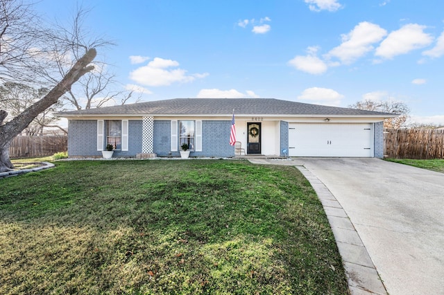 single story home with a front yard, brick siding, driveway, and fence