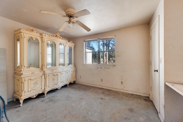 unfurnished dining area featuring ceiling fan