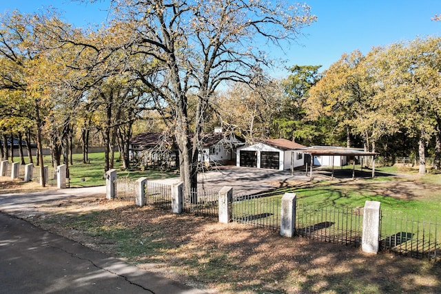 ranch-style home featuring a front yard and a carport