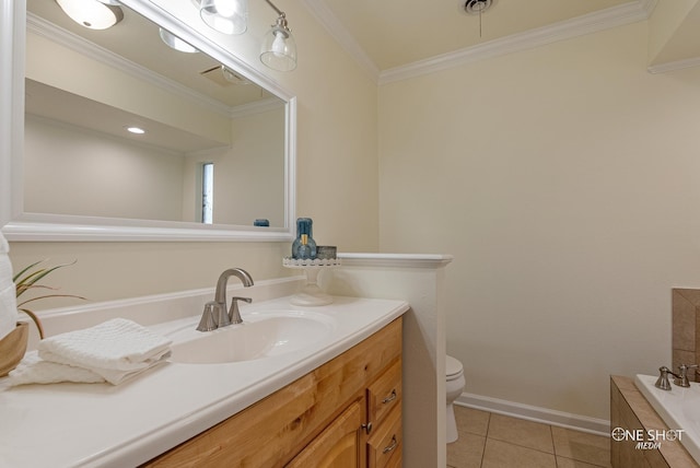 bathroom featuring tile patterned floors, ornamental molding, vanity, toilet, and a bathing tub