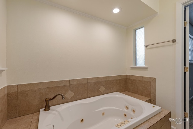 bathroom featuring tile patterned floors, a relaxing tiled tub, and ornamental molding