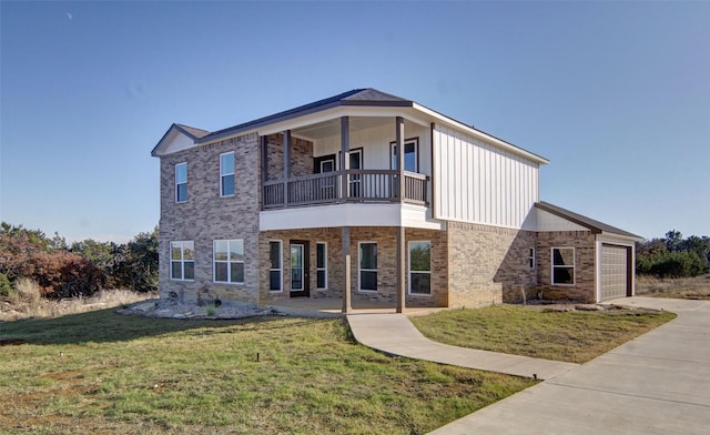 view of front facade with a front yard, a balcony, a garage, and covered porch