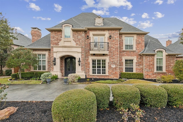 french provincial home featuring french doors