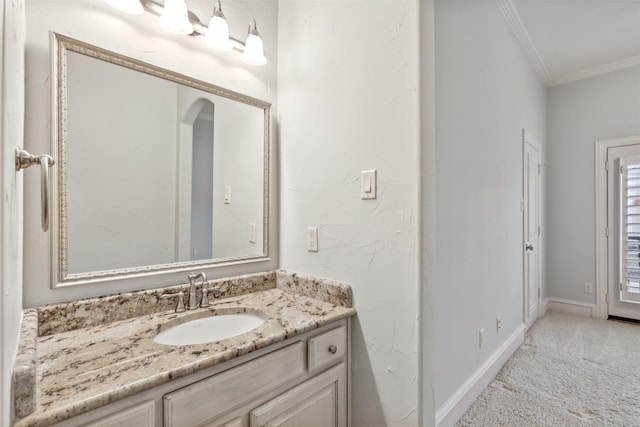 bathroom with vanity and ornamental molding