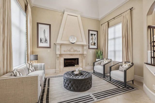 living room featuring crown molding, a fireplace, and light tile patterned floors