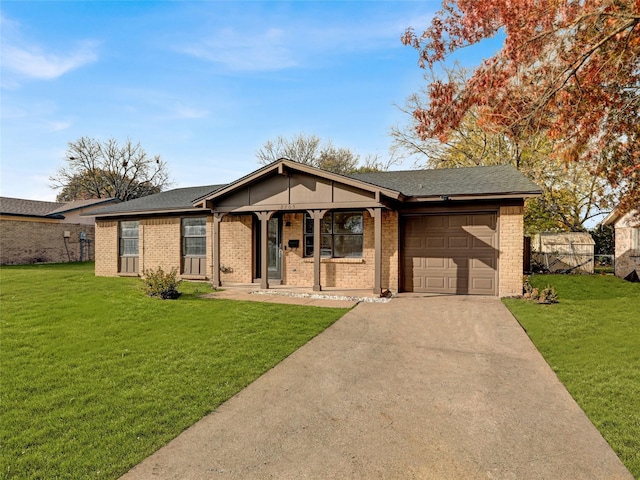 single story home featuring covered porch, a garage, and a front lawn