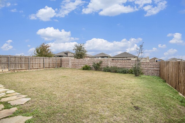 back of property with a patio area and a yard