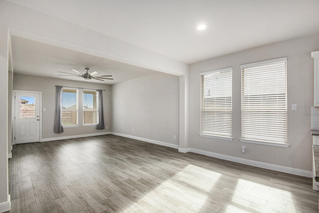 unfurnished room with ceiling fan and light hardwood / wood-style floors