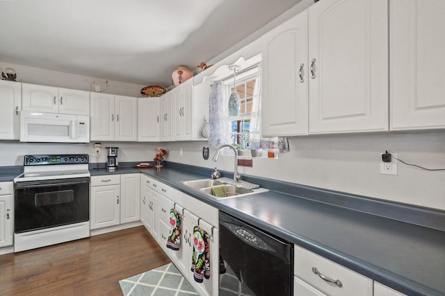 kitchen with white cabinets, dark hardwood / wood-style floors, white appliances, and sink