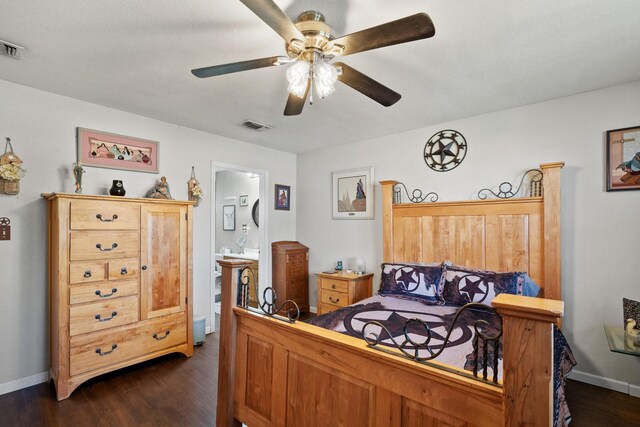 bedroom featuring ensuite bathroom, ceiling fan, and dark wood-type flooring