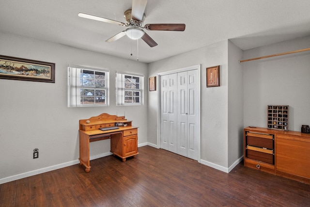 office space featuring dark hardwood / wood-style flooring and ceiling fan