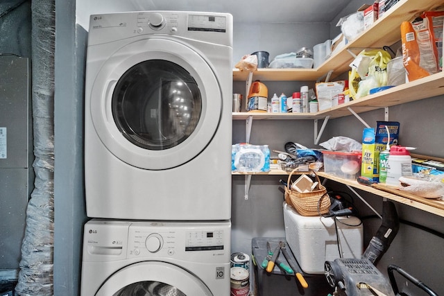 laundry room with stacked washer and dryer