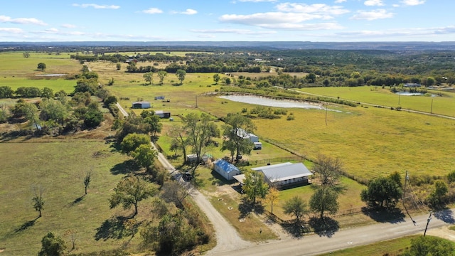 drone / aerial view with a rural view and a water view