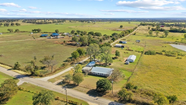 drone / aerial view with a rural view and a water view