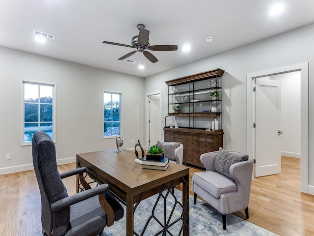 office area with ceiling fan and light wood-type flooring