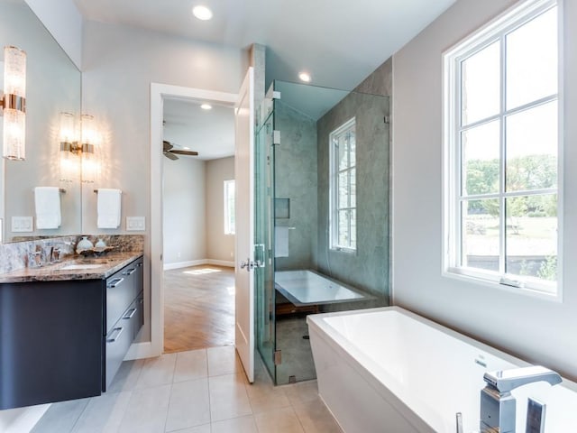 bathroom featuring wood-type flooring, plenty of natural light, and ceiling fan