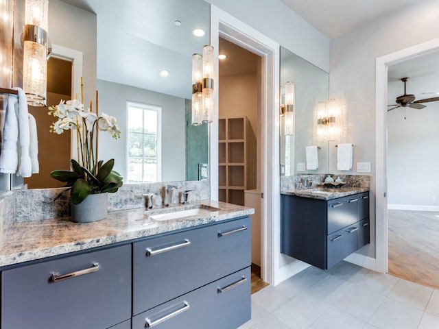 bathroom featuring vanity, hardwood / wood-style floors, backsplash, and ceiling fan