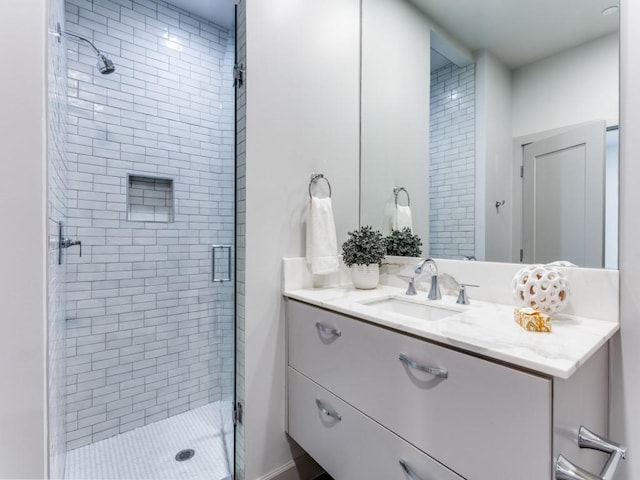 bathroom with vanity and walk in shower