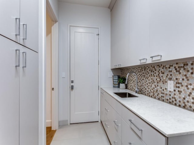 kitchen featuring sink and tasteful backsplash