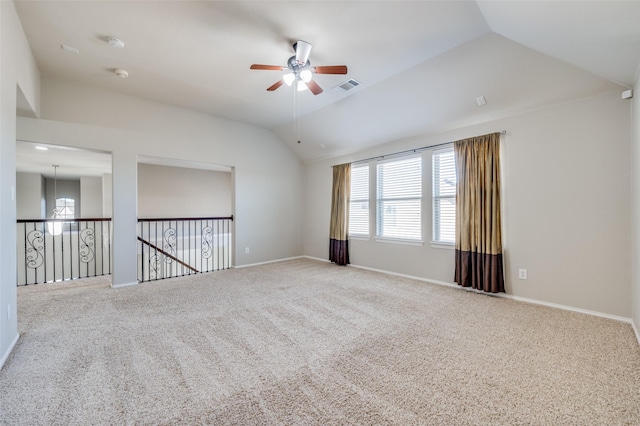 unfurnished room with carpet flooring, ceiling fan, and vaulted ceiling