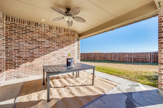 view of patio featuring ceiling fan