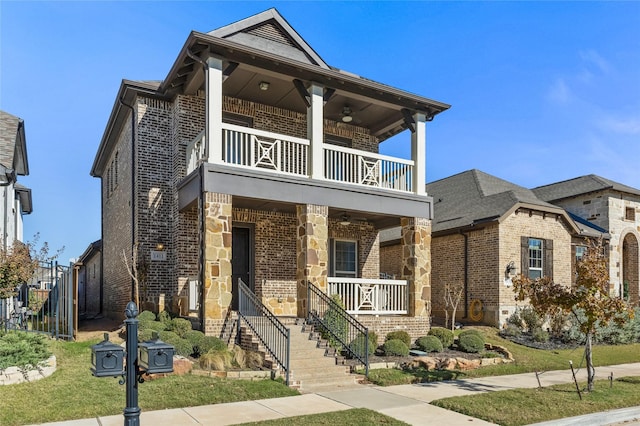 view of front facade with covered porch and a balcony