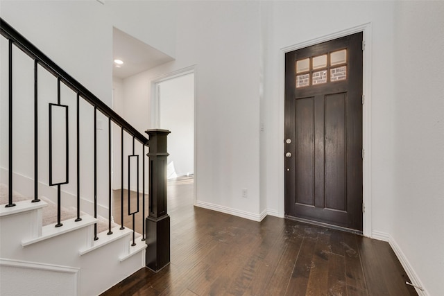 entrance foyer featuring dark wood-type flooring