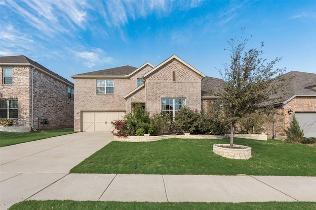 traditional home with driveway, a garage, a front lawn, and brick siding