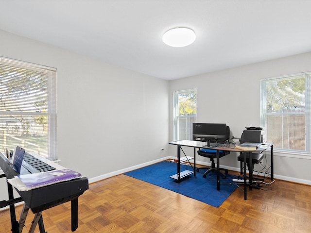 office space with parquet flooring