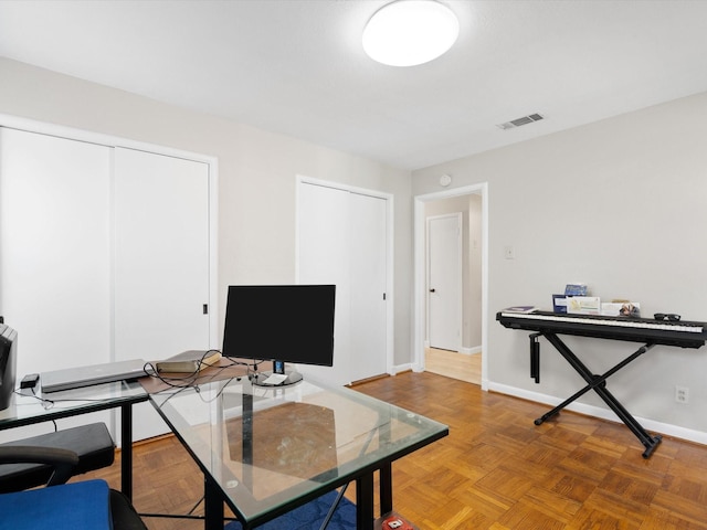 office featuring parquet floors