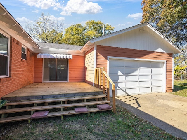 exterior space with a garage and a deck