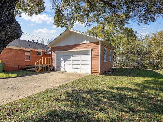 garage with a lawn