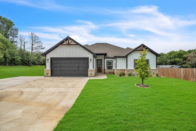 view of front of house featuring a garage and a front lawn