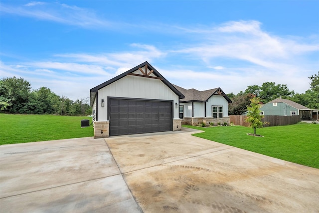 view of front of house with a garage and a front yard